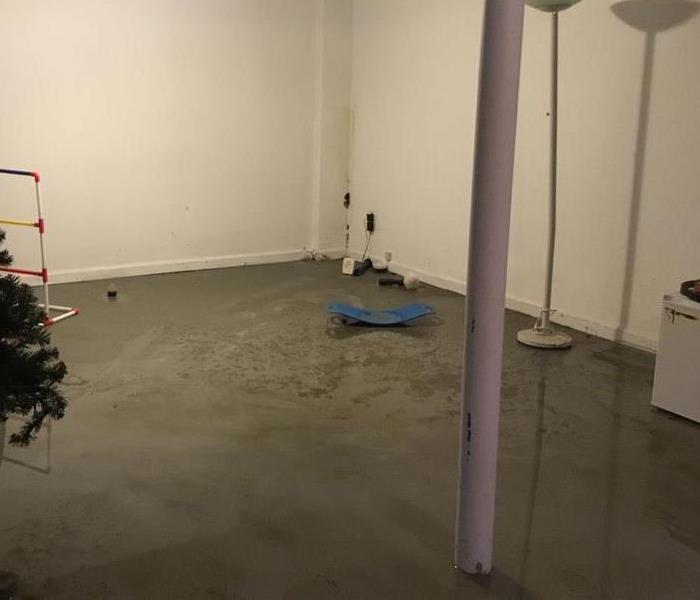 Main living area in unfinished basement flooded after storm
